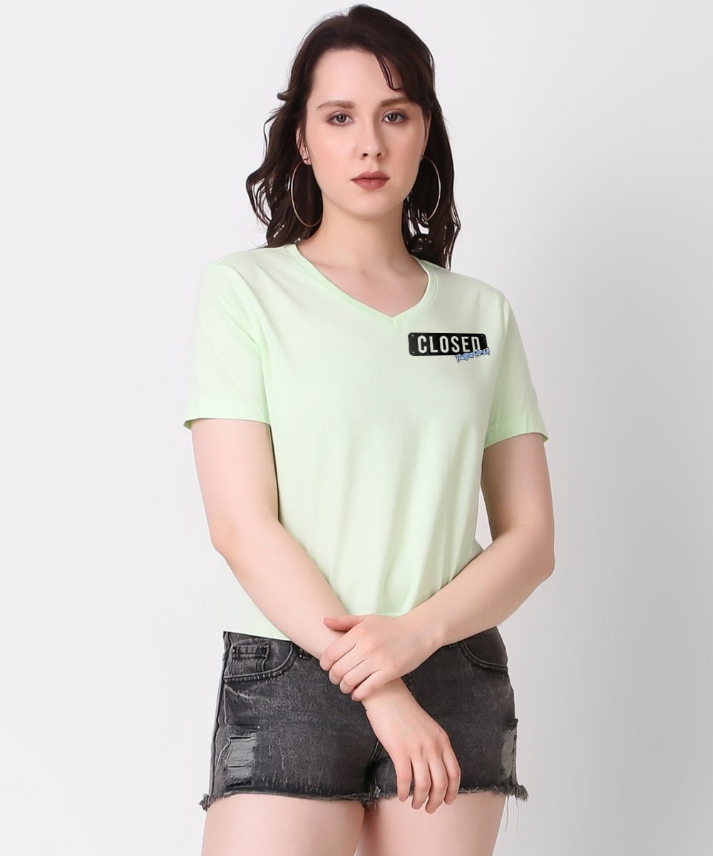 light-green-v-neck-top-with-print-on-it-closed-temporarily